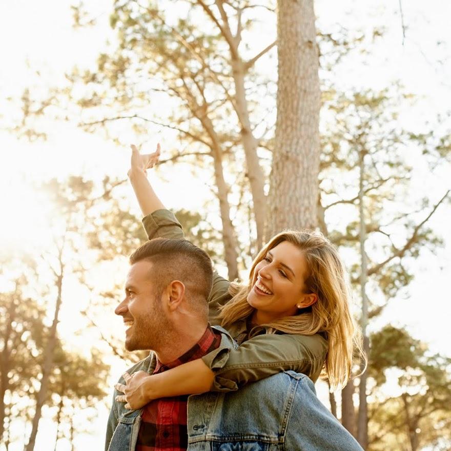 Couple Smiling under Trees