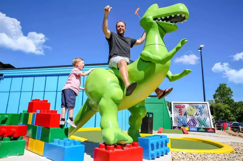 family with dinosaur