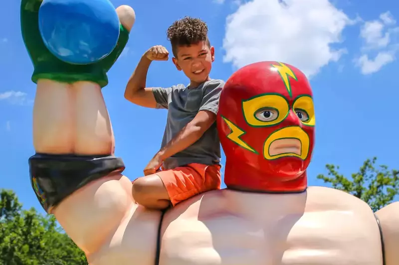 action figure with kid on shoulder