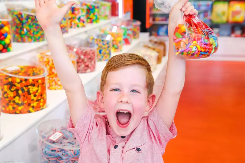 happy kid in candy store