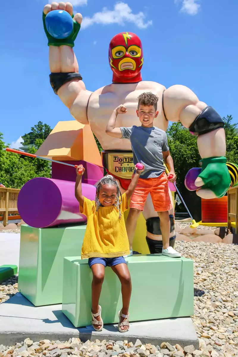 kids with toys at mini golf course