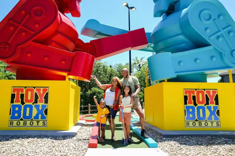 family with giant robot toys