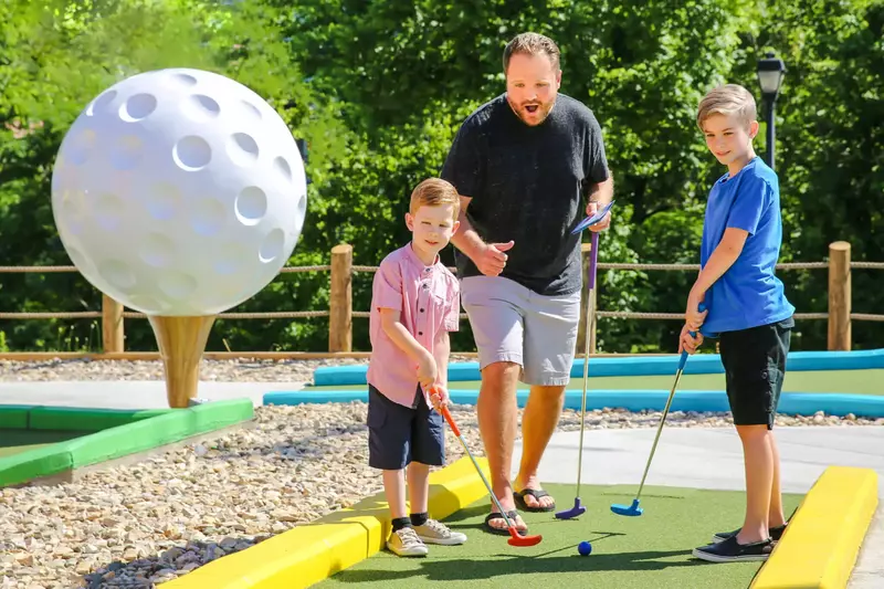 family at mini golf course