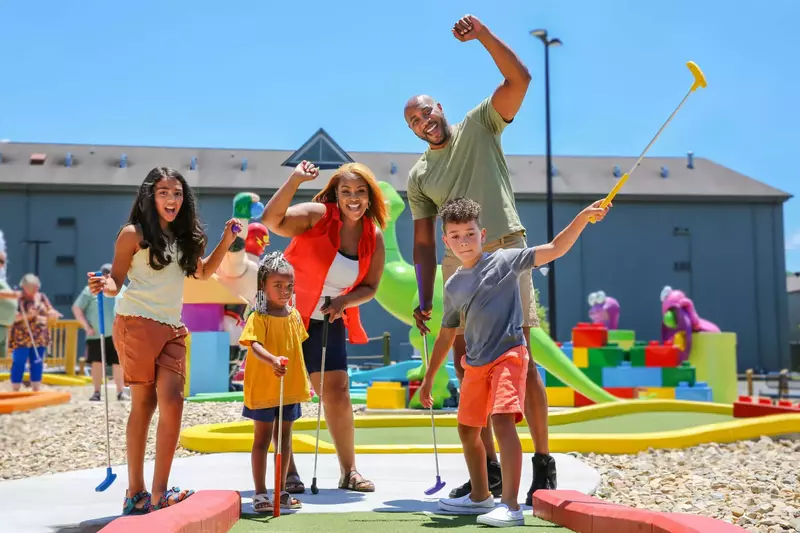 family at mini golf course
