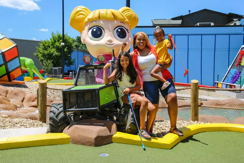 family at mini golf course
