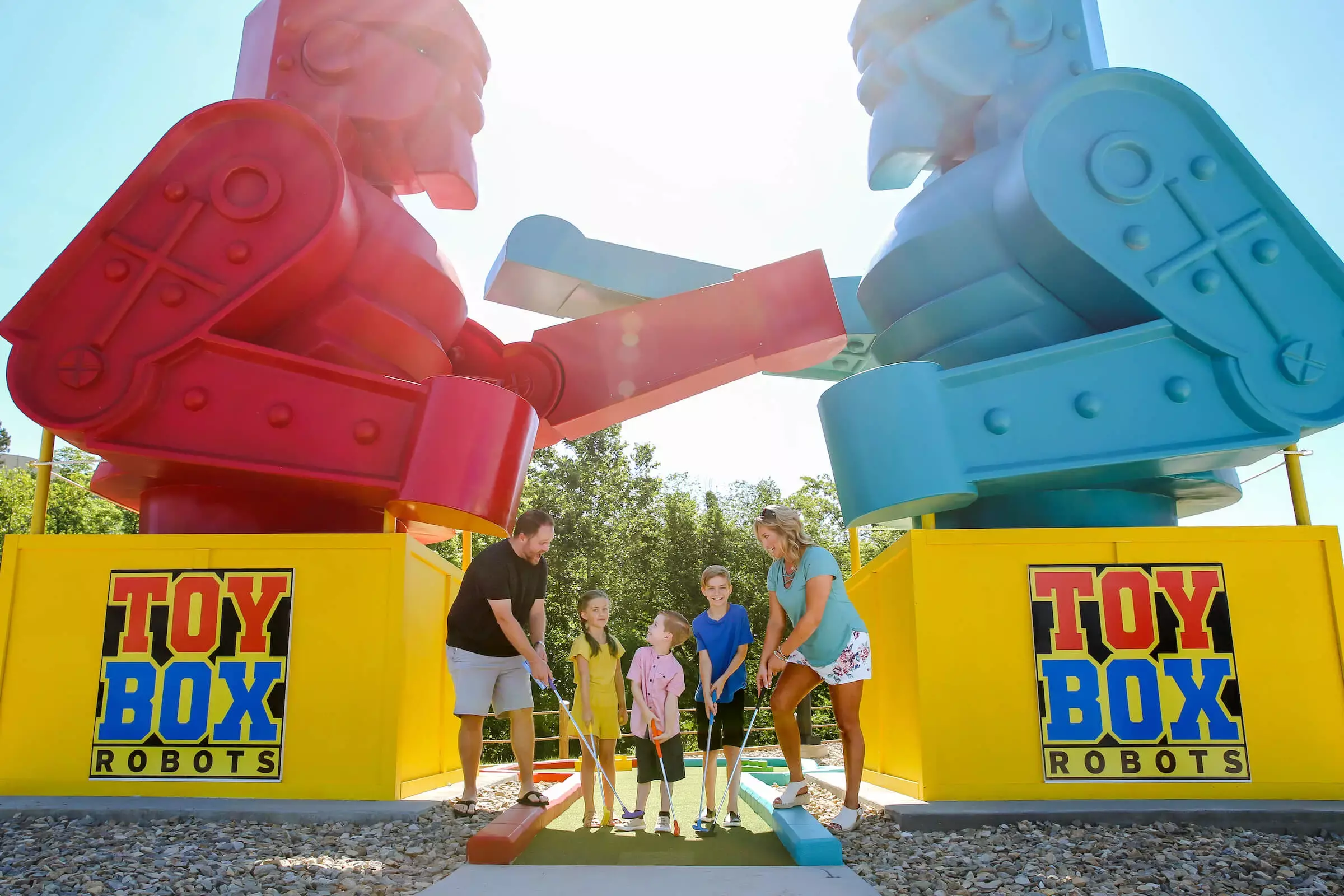 family under giant robot figures